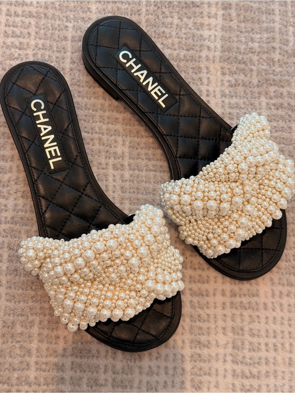 CHANEL Black Quilted Slide Mules with Pearl Embellished Strap
